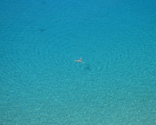 Swimmer laying in the Caribbean Sea