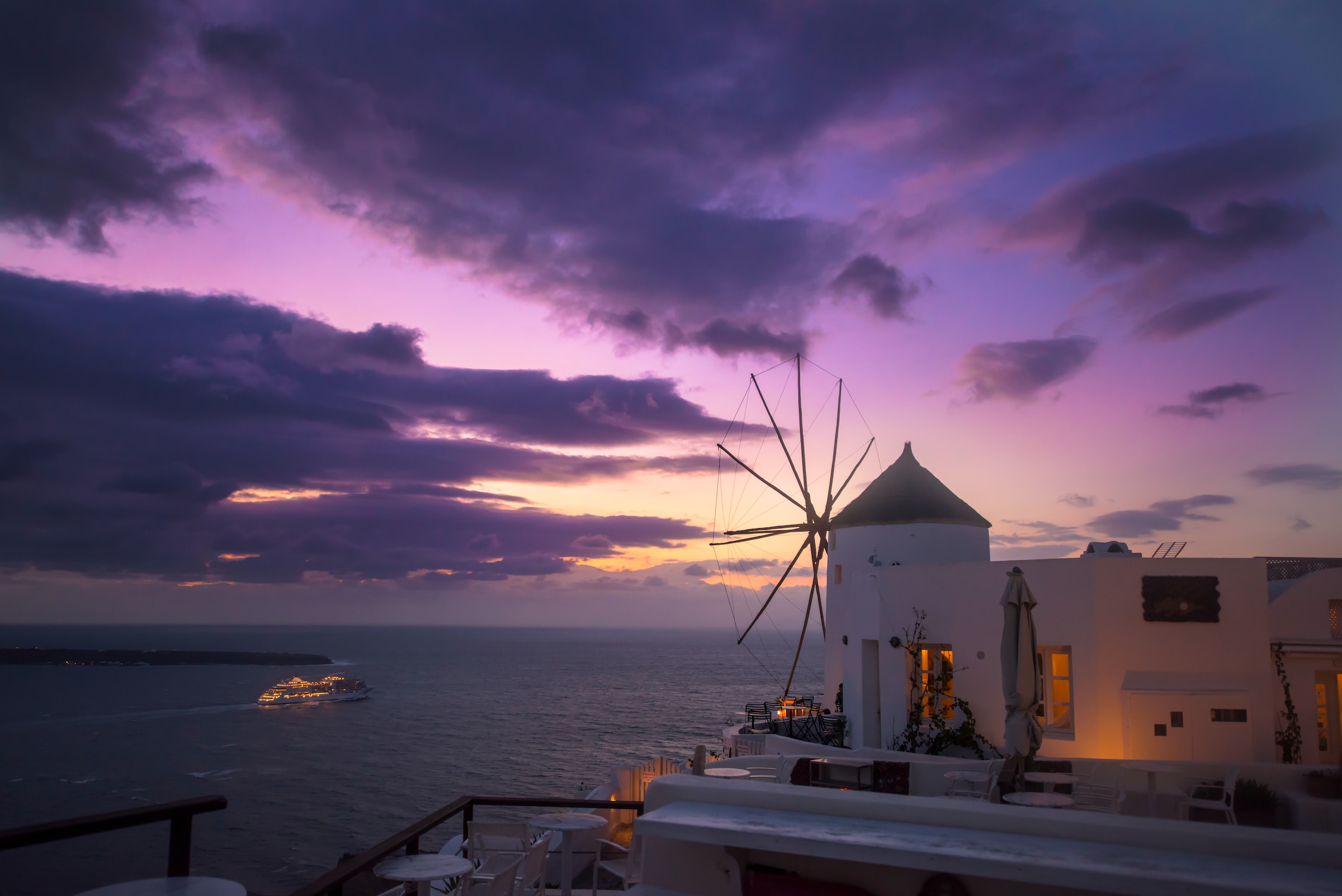 Santorini windmills in purple skies