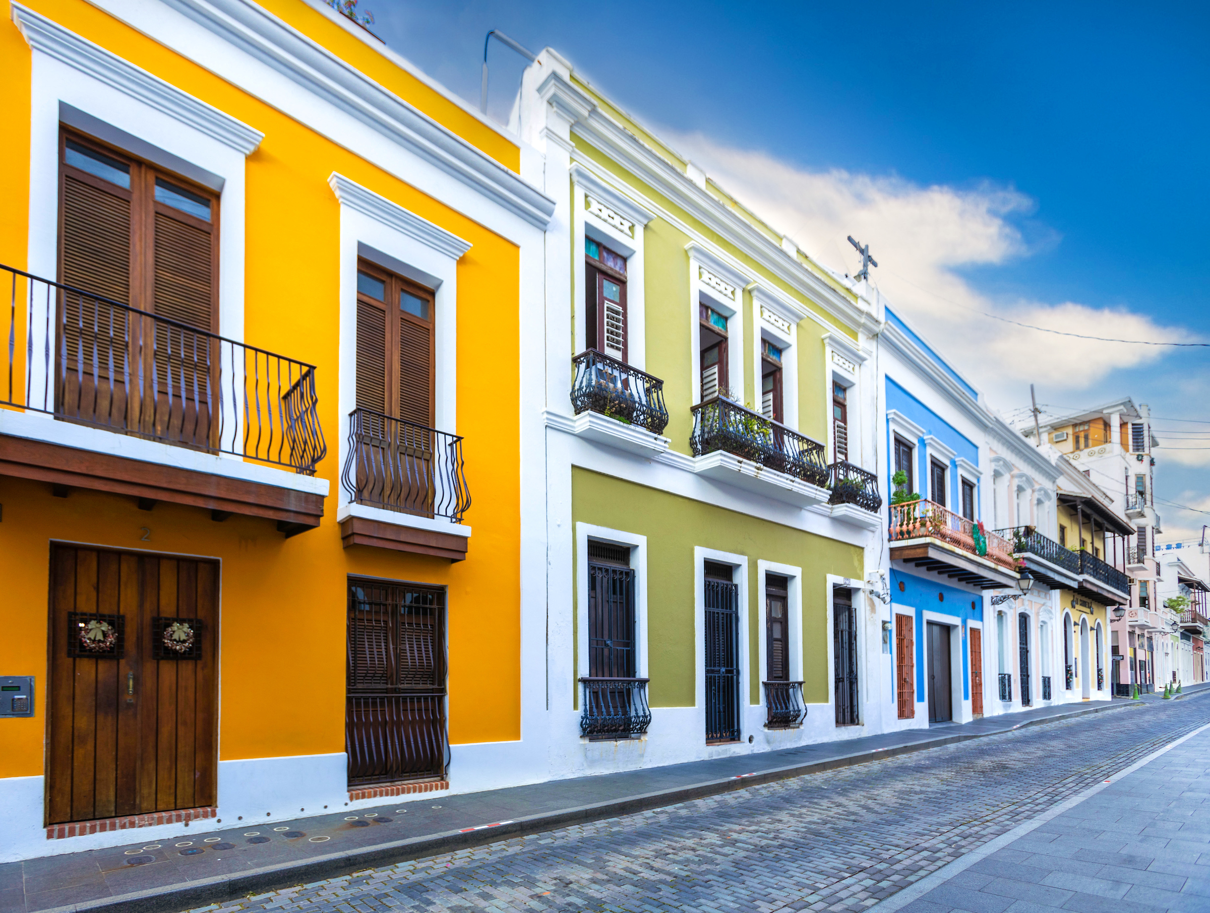 Colourful bright buildings along road