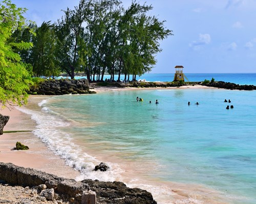 Swimmers in the shallow waters of tropical blue water