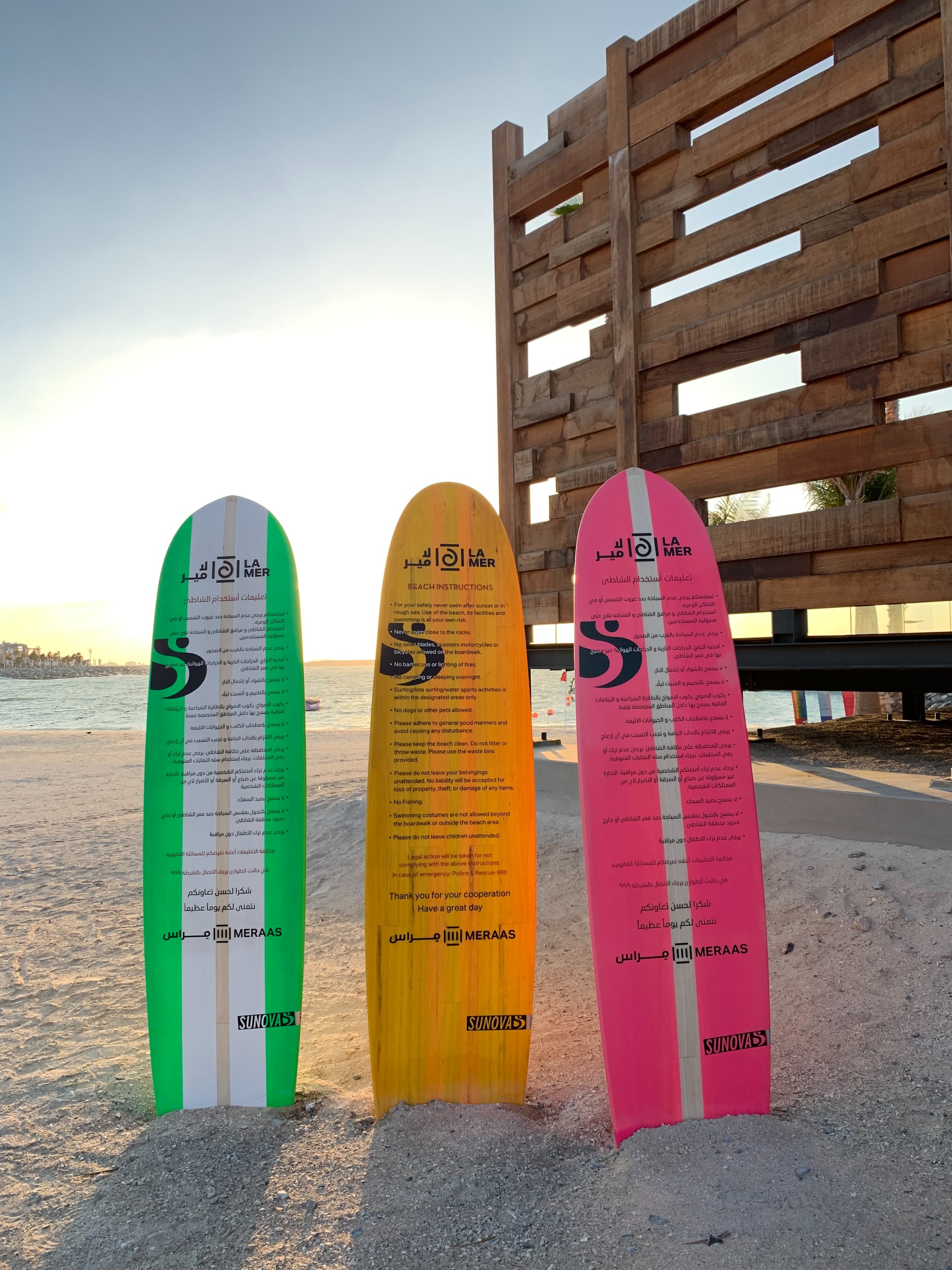 Three surfboards in the sand on the beach
