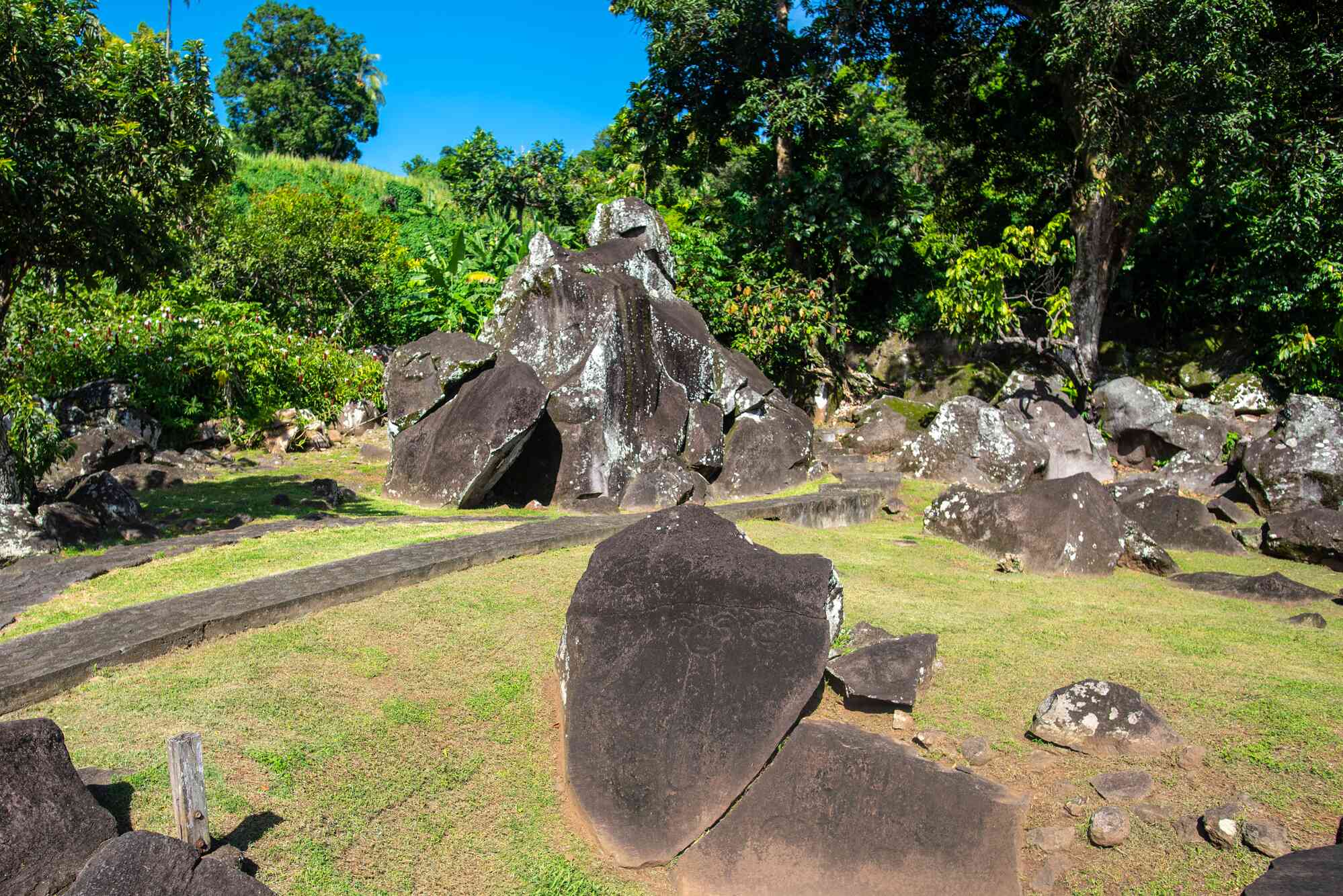 Large rocks with basic drawings carved in them 