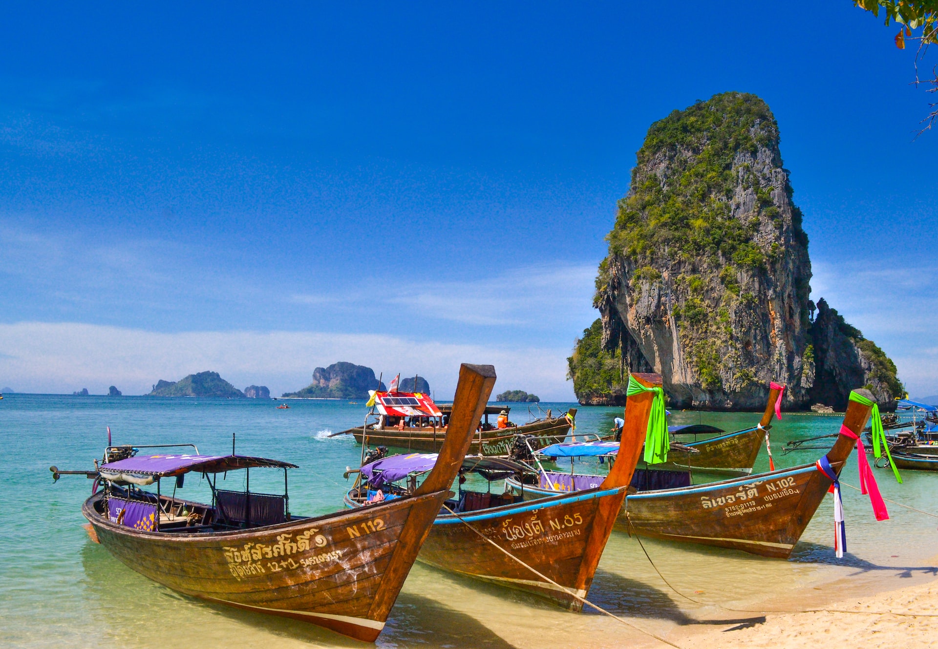 Wooden boats docked up on a breath-taking bay