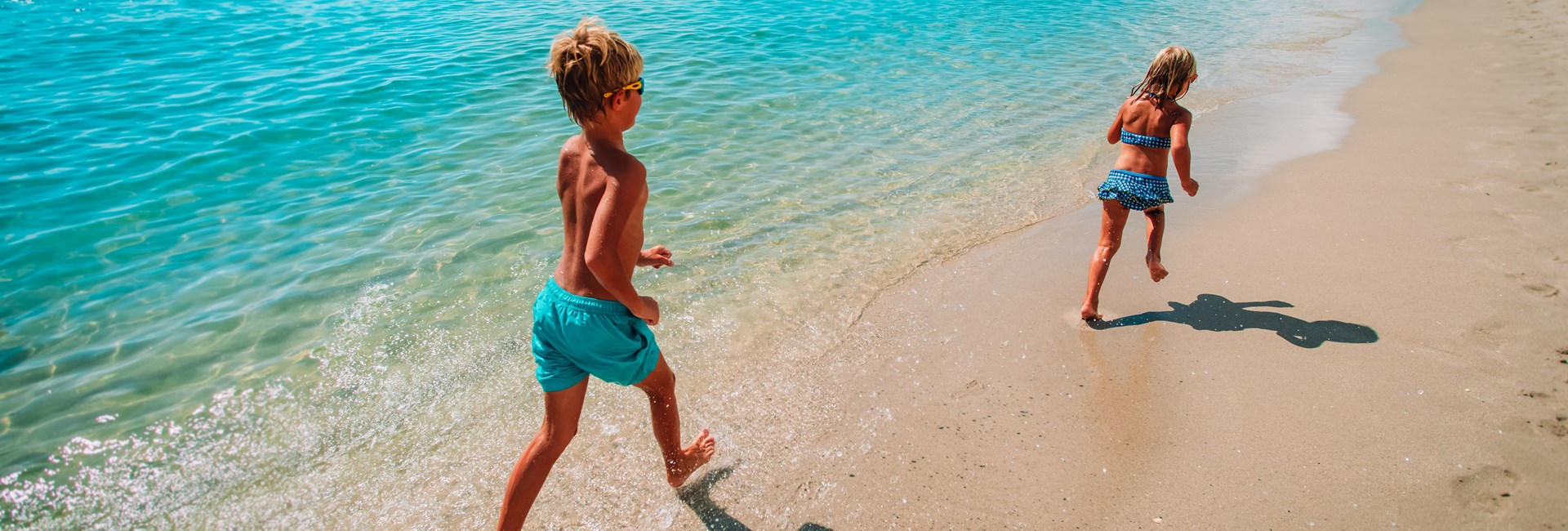 Children running on beach