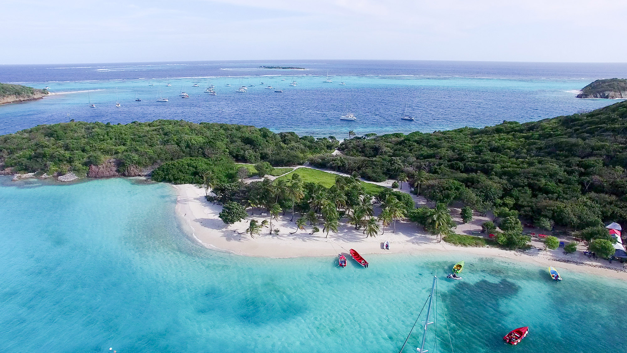 Sky view of a small white sand beach of the peninsula of a tropical island