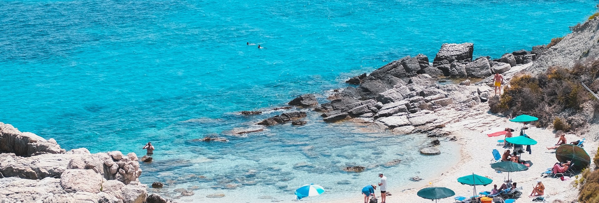 secluded bay fringed by rocky outcrops