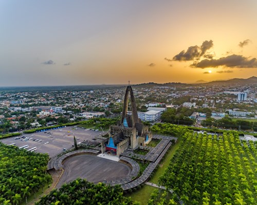 The sun setting behind Basilica Nuestra Senora de la Aatagracia in Higuey