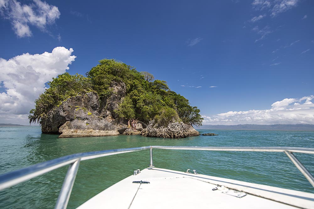 Boat sailing towards a small off-shore island