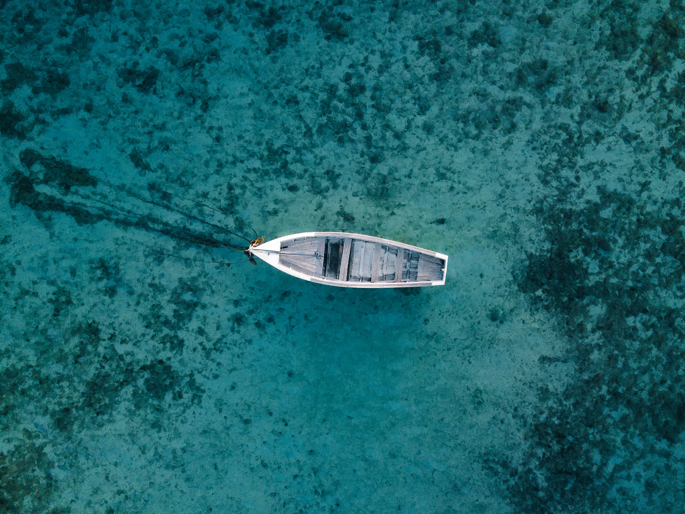 A boat floating on azure waters