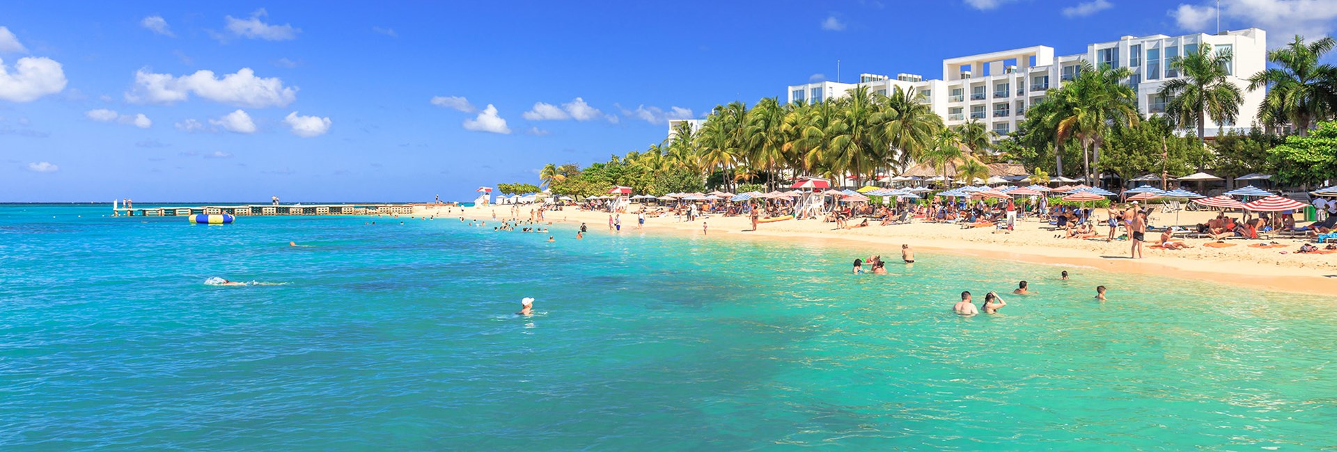 Lots of holidaymakers having fun on a Caribbean beach