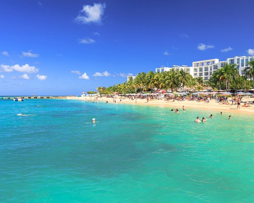 Lots of holidaymakers having fun on a Caribbean beach