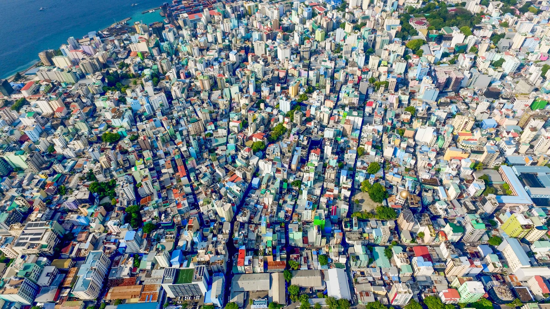 Aerial shot of colourful architecture and building surrounded by water