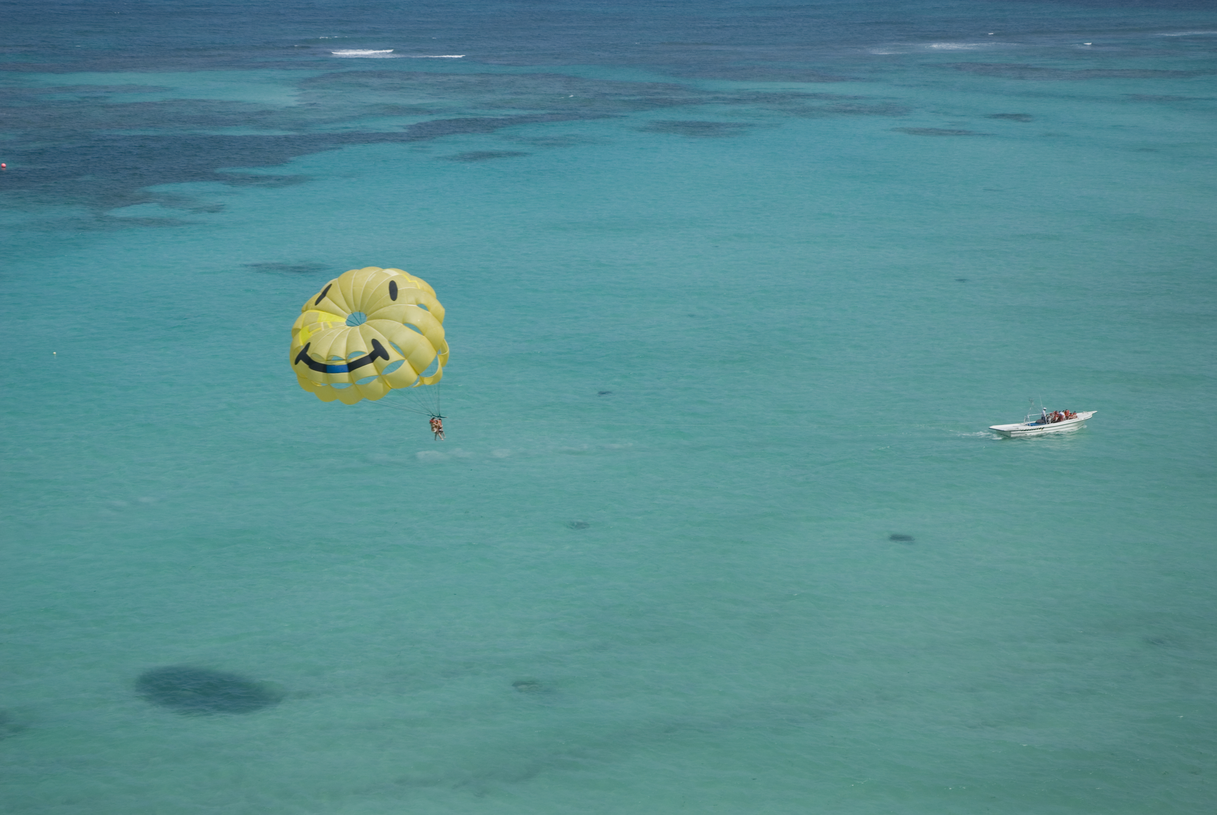 Parasailing with a yellow sail at Bavaro Beach