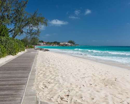 Boardwalk along white sand beach