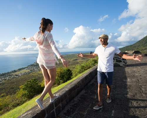 A couple standing by a wall  at Brimstone Hill Fortress and National Park