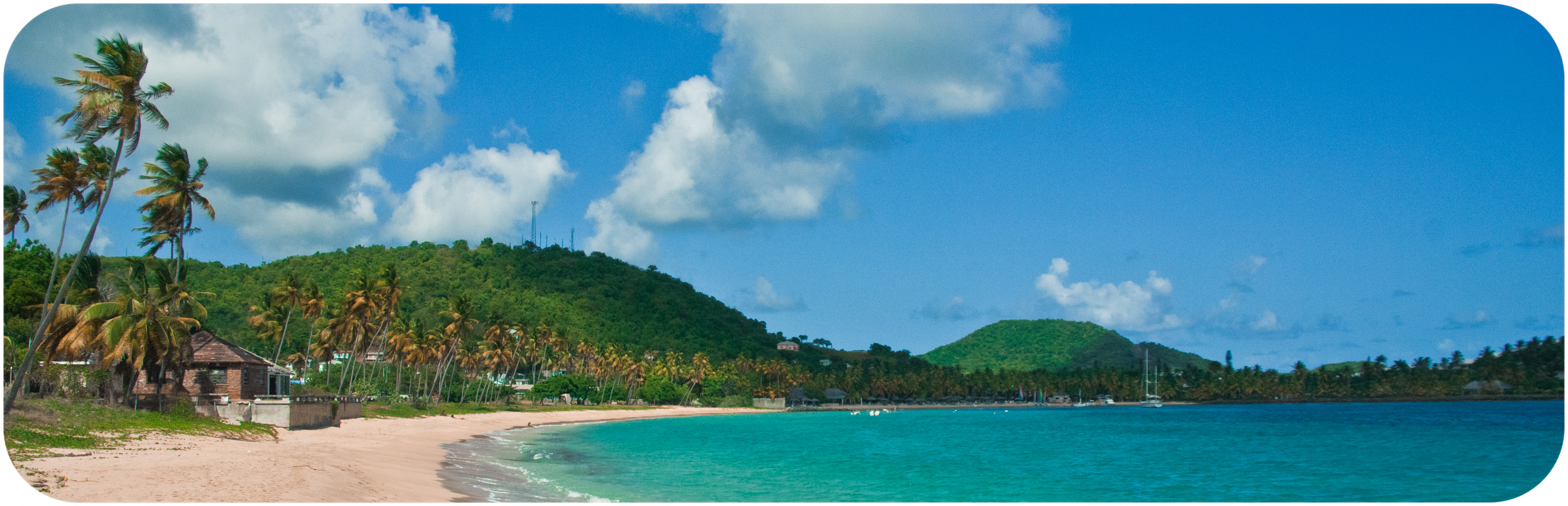 Stretch of beach and lush Hills at Morris Bay in Antigua