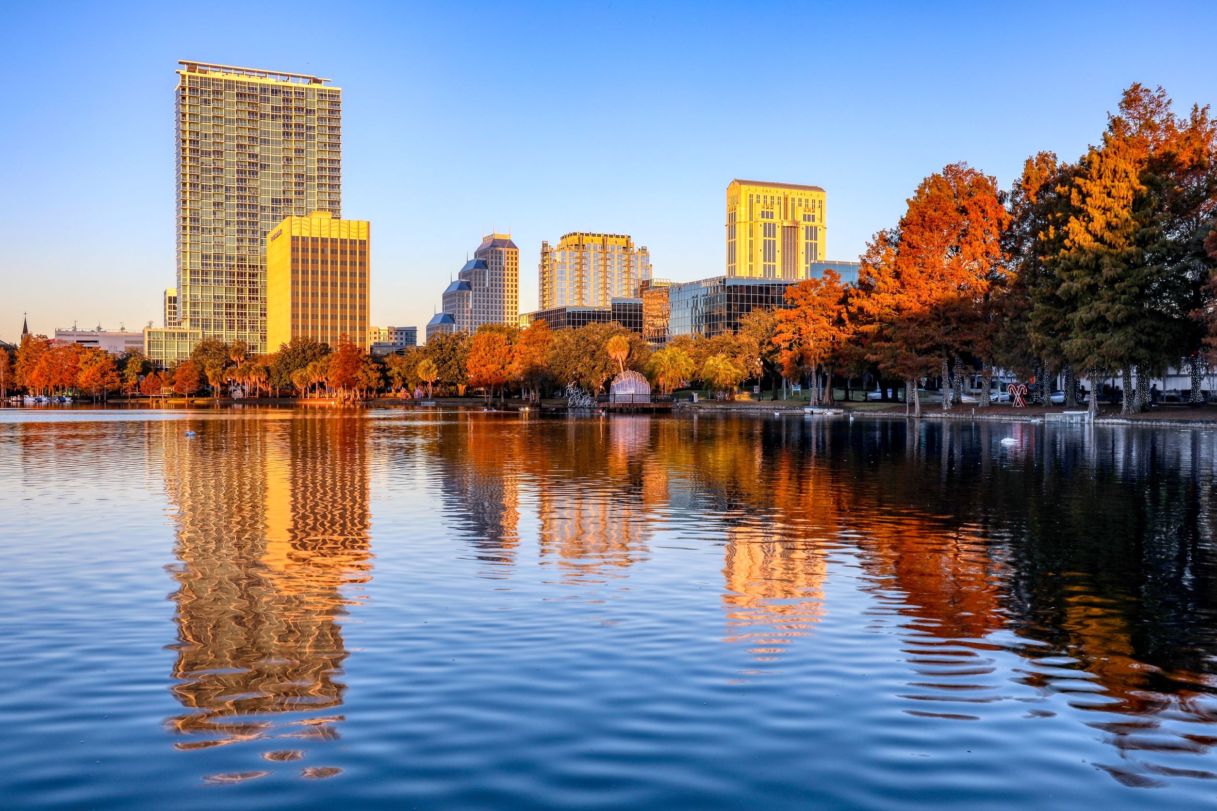 Photo of Lake Eola with a reflection of buildings