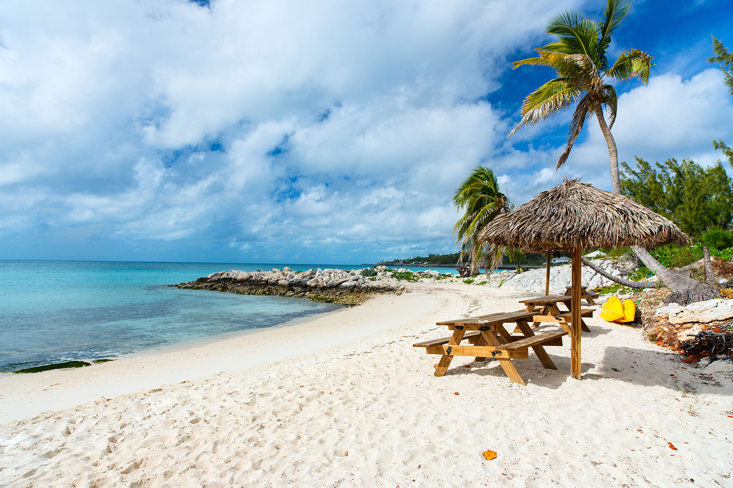 Wooden benches on a beautiful tropical beach
