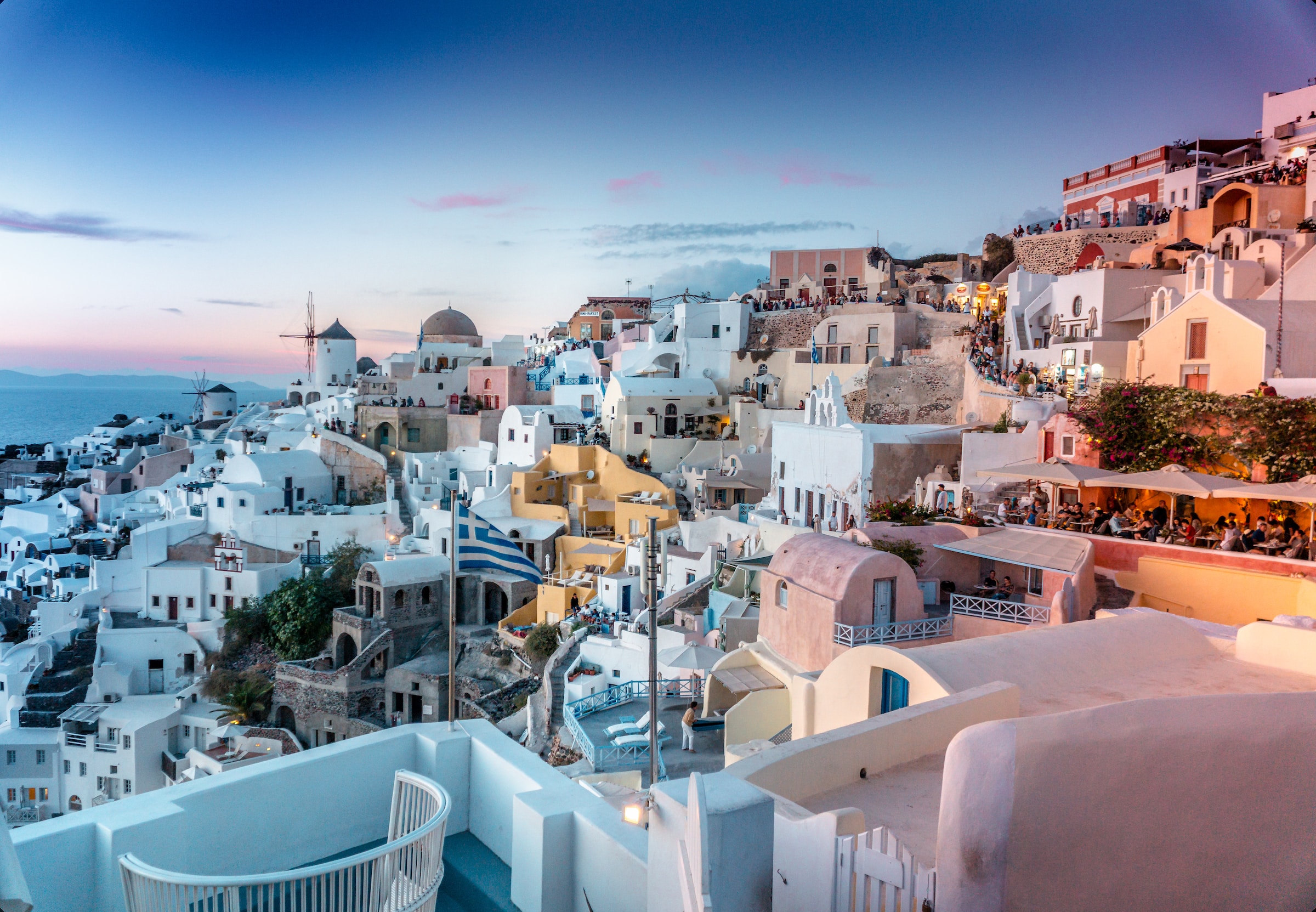 Cycladic houses perched on a hill in the evening