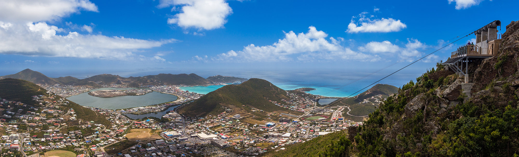 View of mountainous tropical island on a sunny day from the top of a mountain