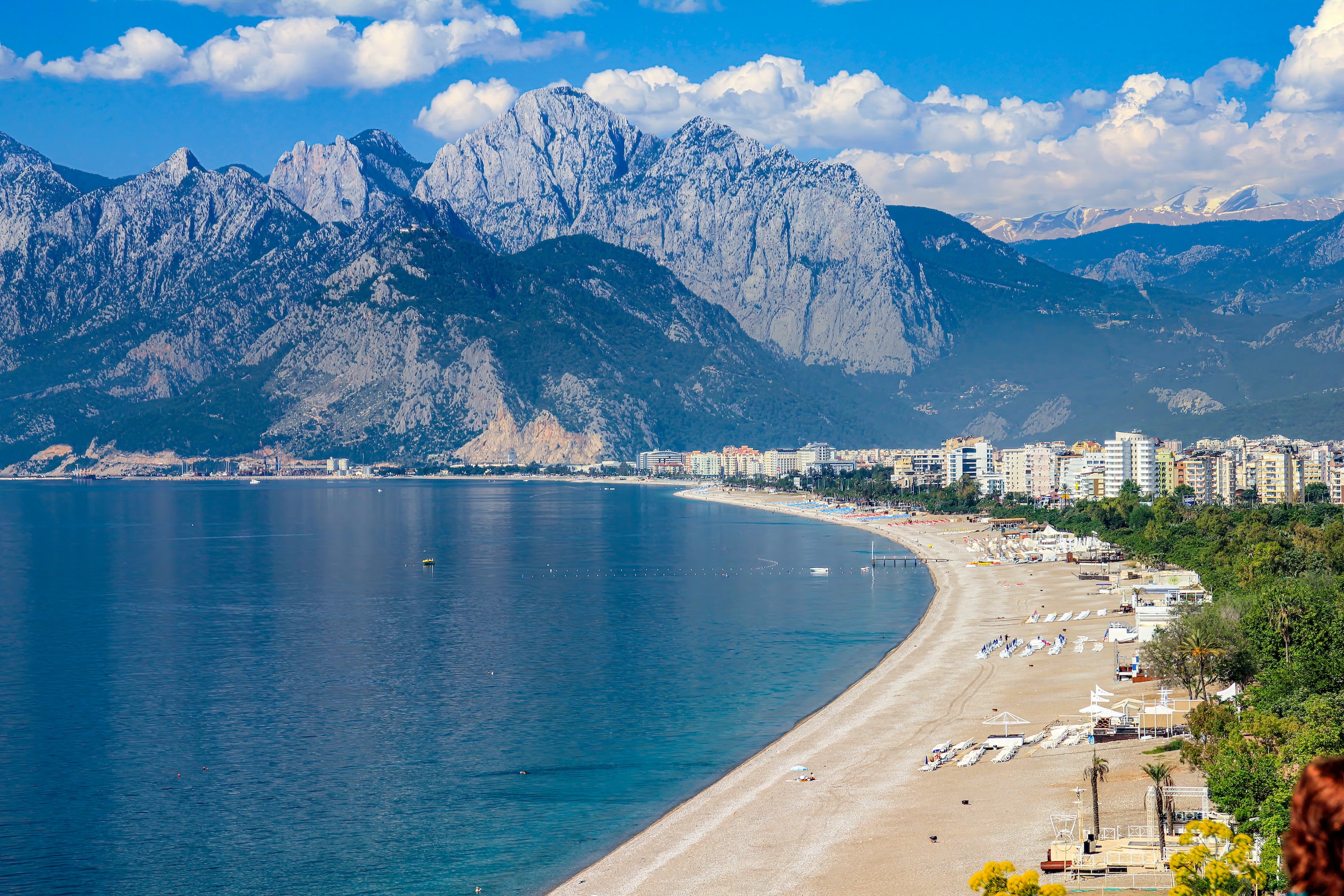 A beautiful, crescent beach backed by tall mountains