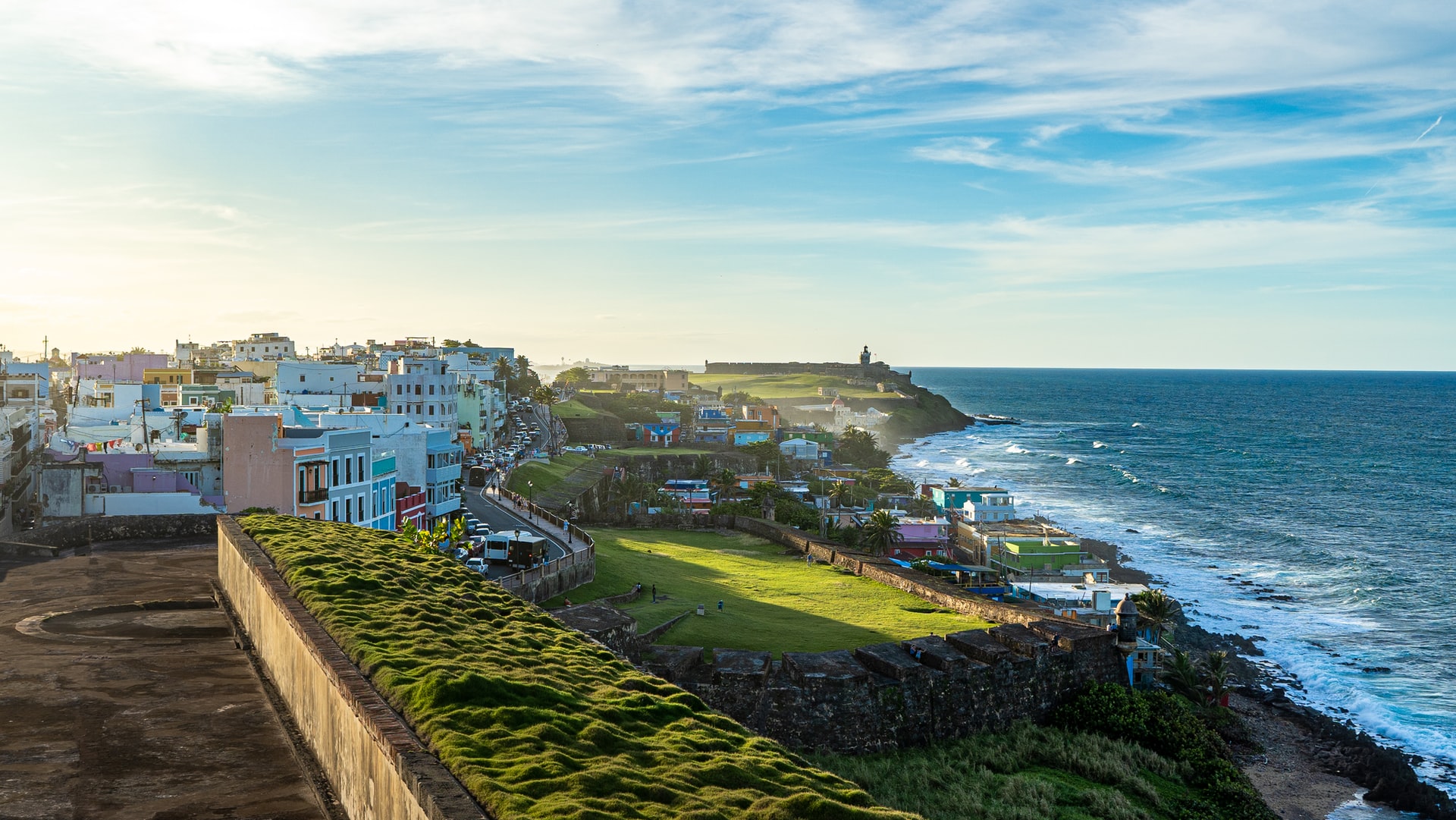 A town of colourful building along the coast 