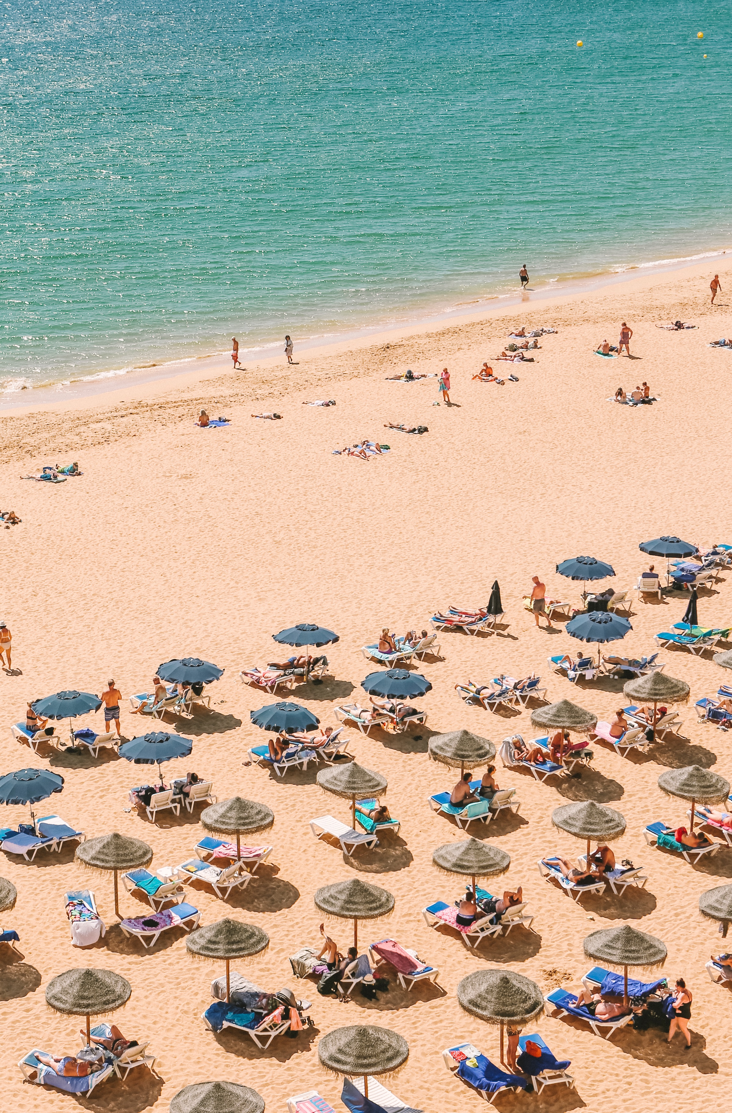 People lounging on Bitez Beach