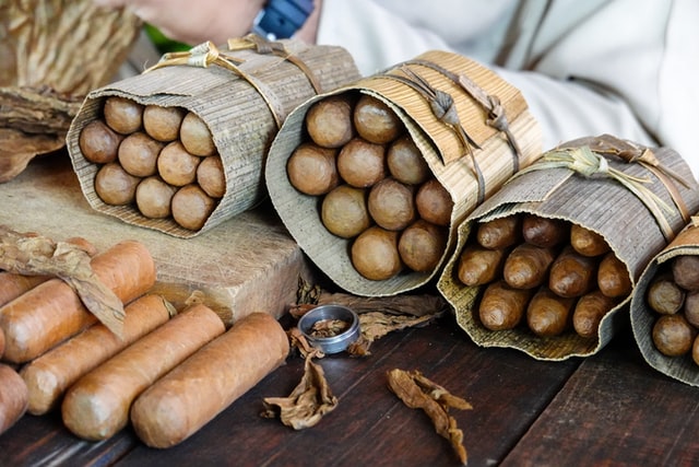 Cuban cigars rolled up in brown paper packaging