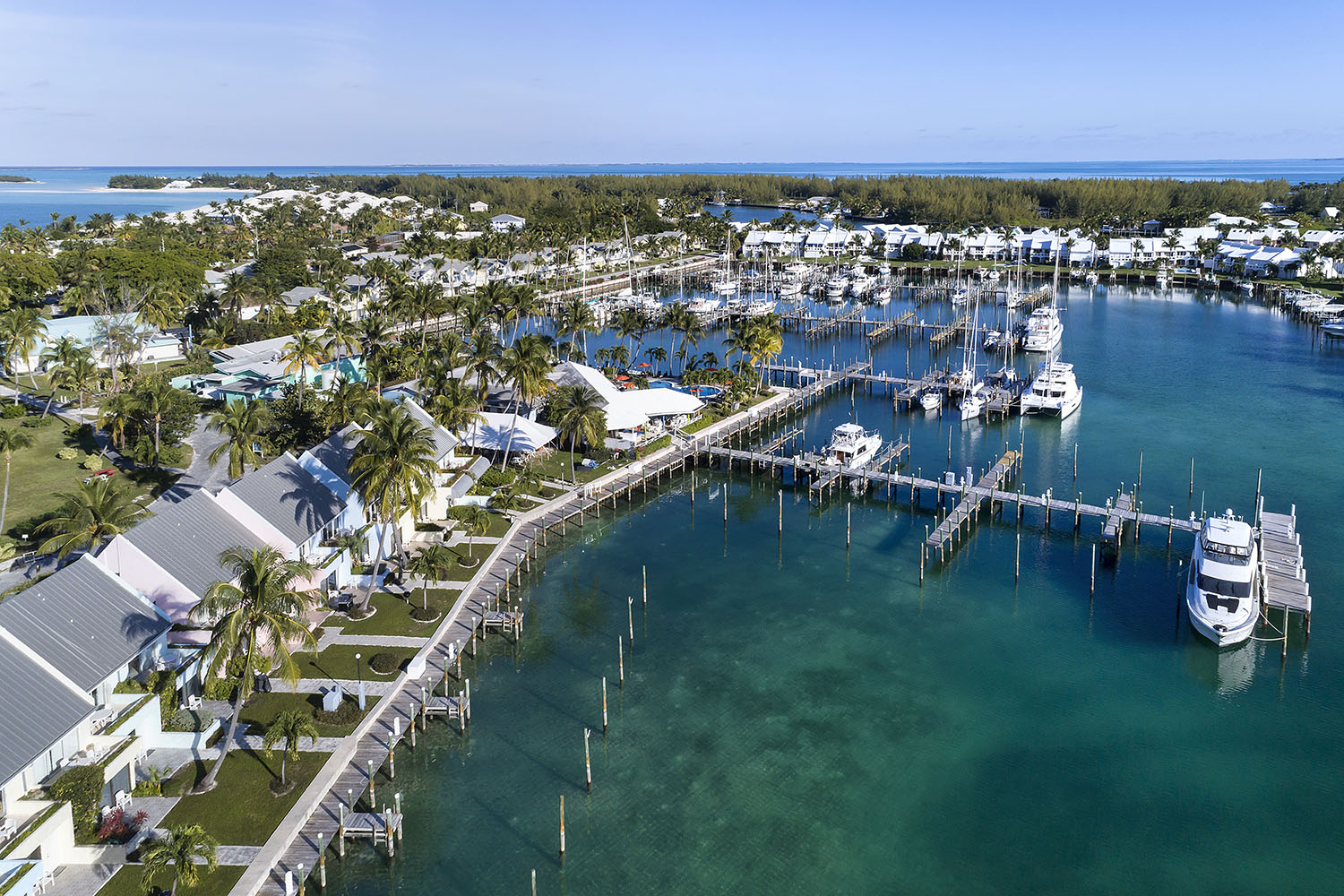 Private boat docks and oceanside bungalows in Treasure Cay Marina