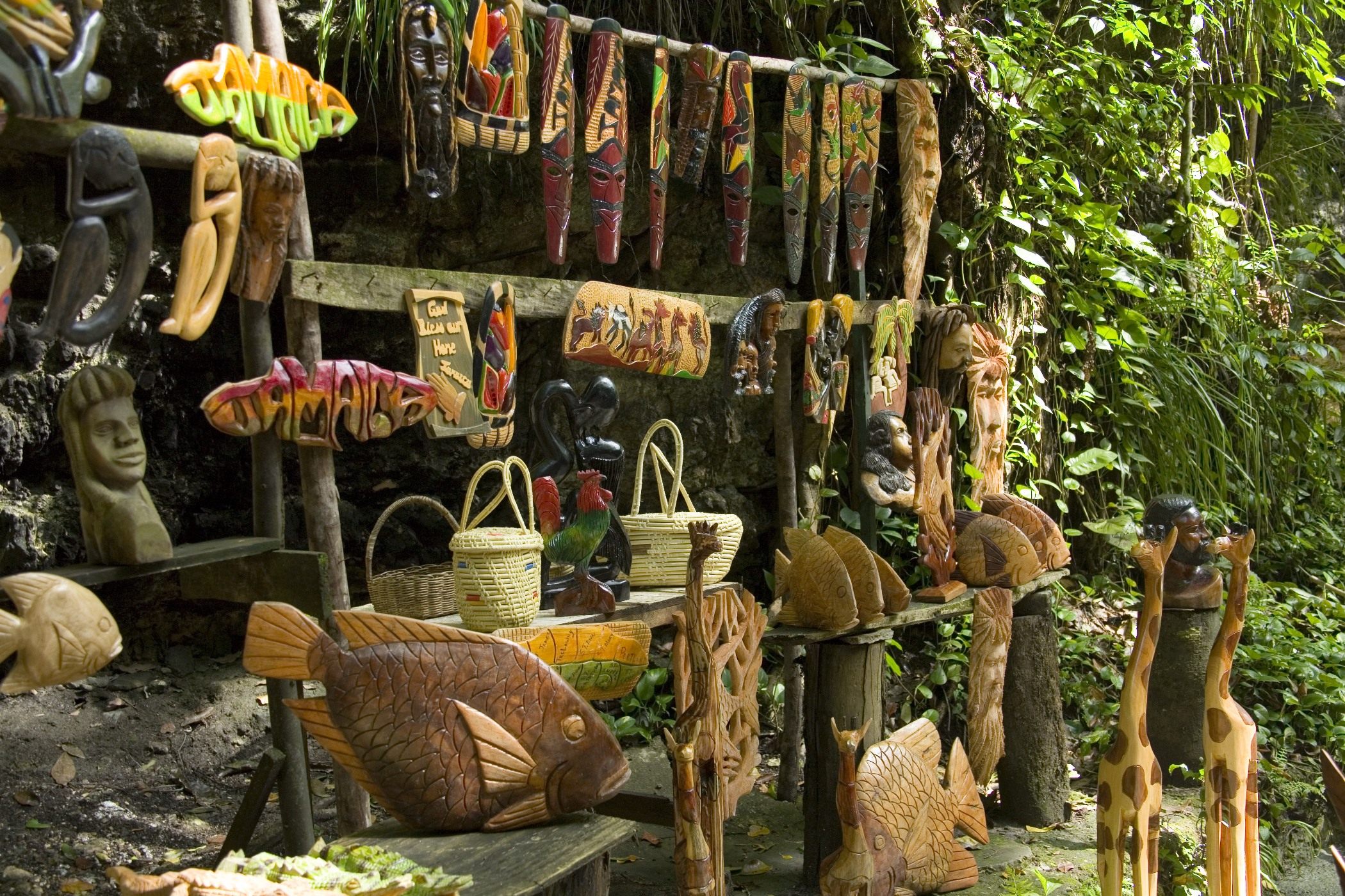 Wooden sculptures and local goods on a gift stall in Jamaica 