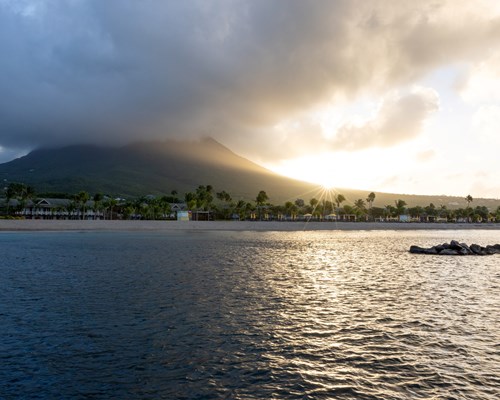 Sunrise over and a mountain and tropical beach