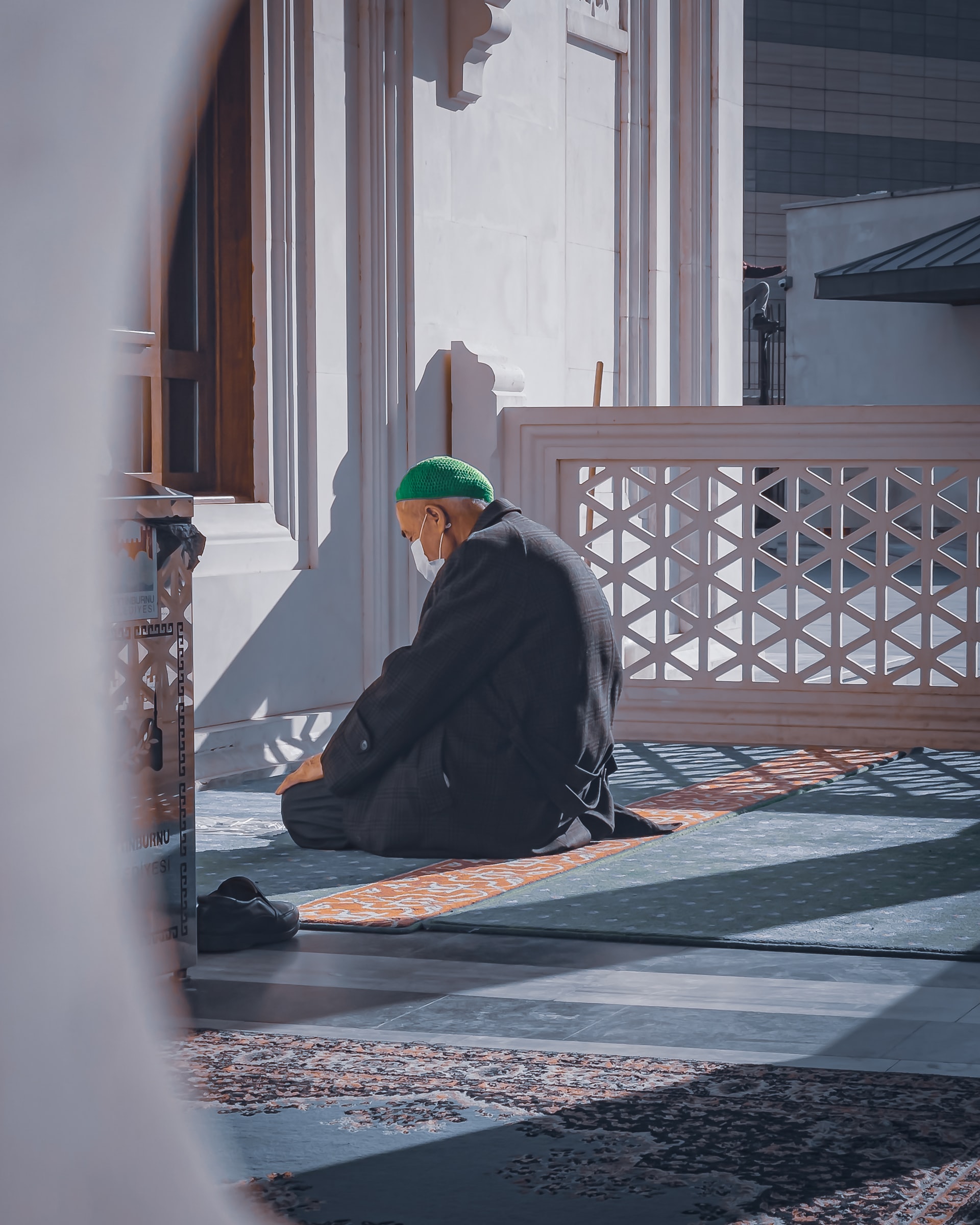 A man praying inside a mosque
