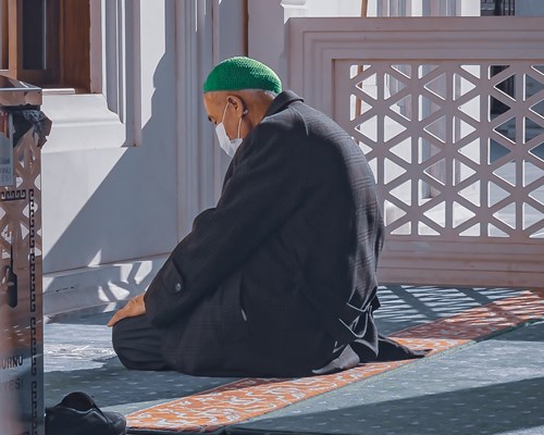 A man praying inside a mosque