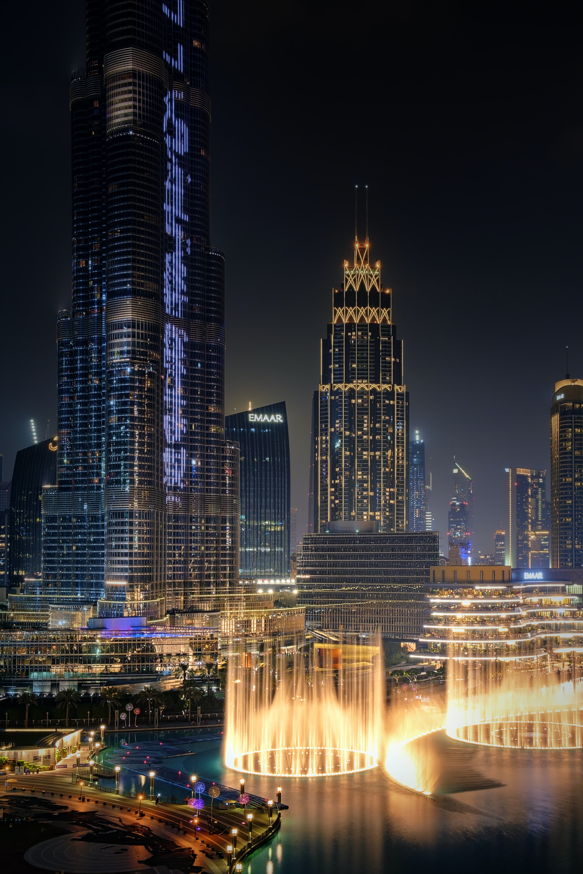 The city and the Dubai Mall with fountains at night