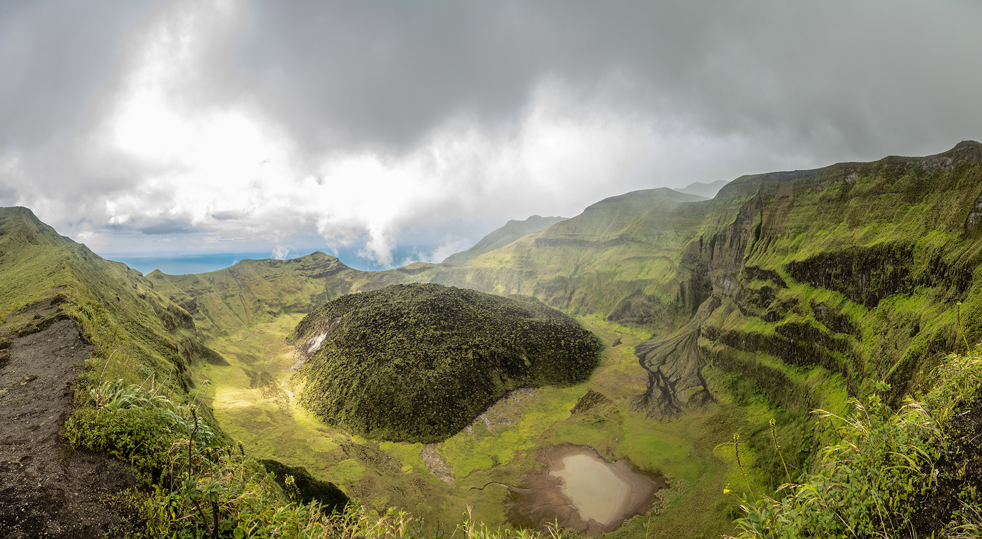 La Soufriere volcano crater panorama with tuff cone hidden in green