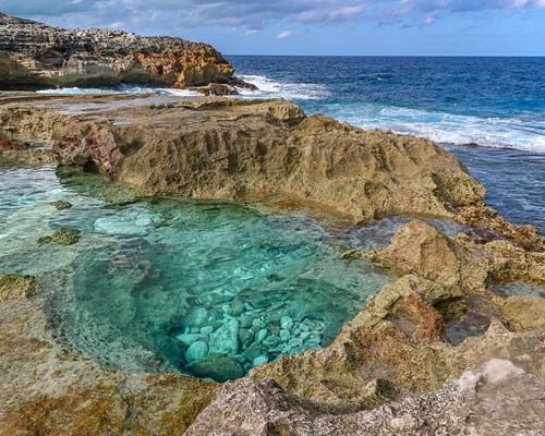 Large rock pool on the edge of a cliff