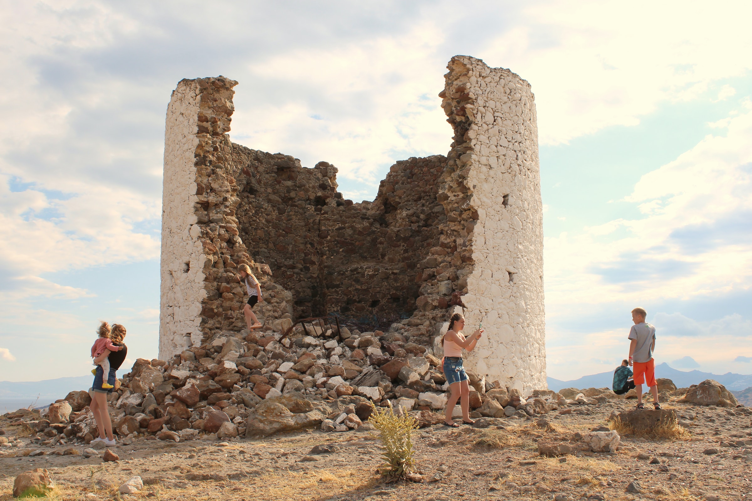 Four people exploring a destroyed castle