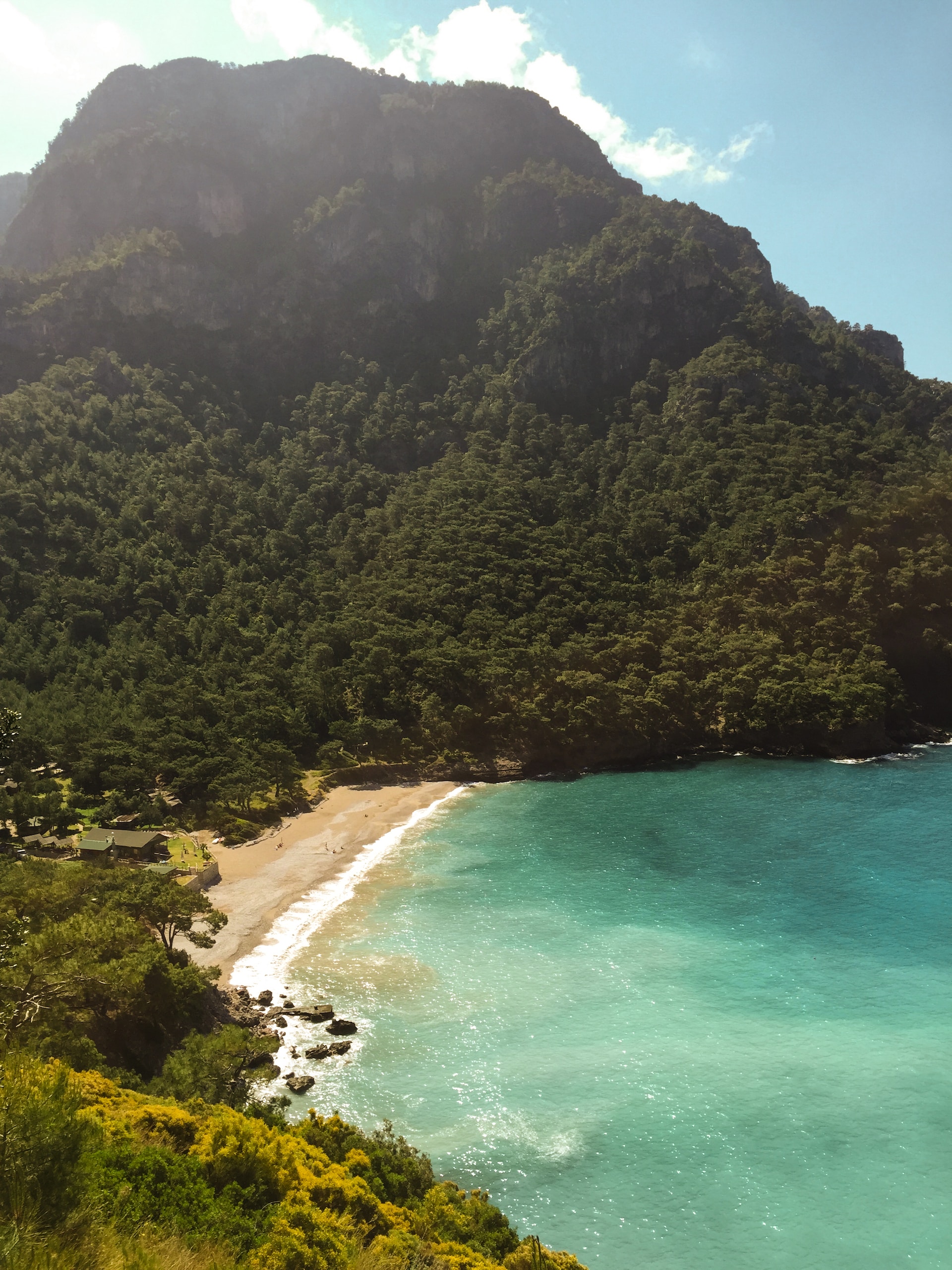 Kabak Beach surrounded by lush greenery