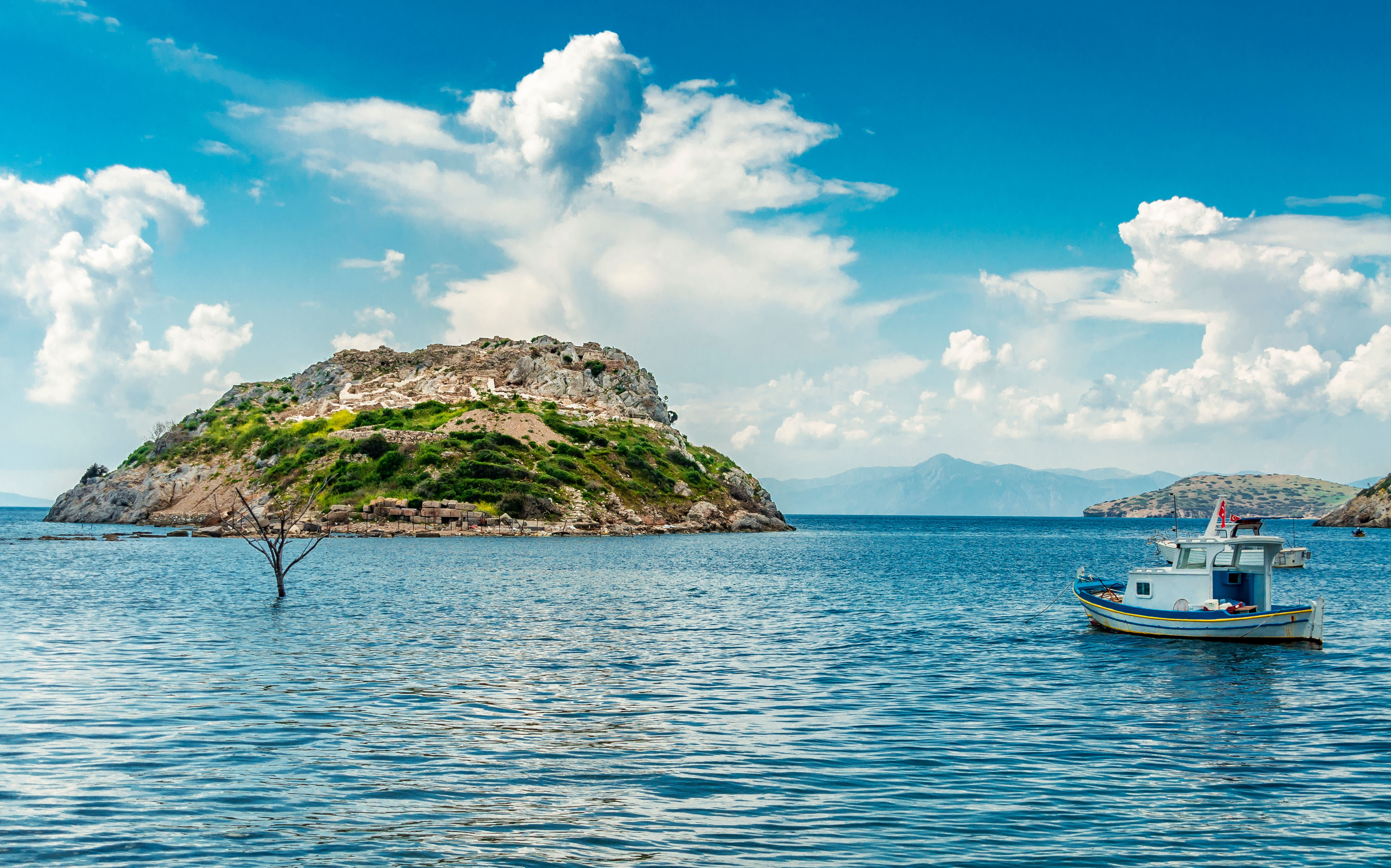 Rabbit island view from Gumusluk village with fishing boat in Bodrum