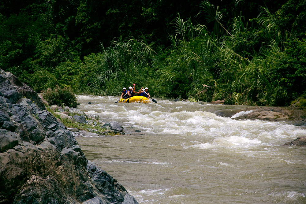 A group of people water rafting in Jarabacoa