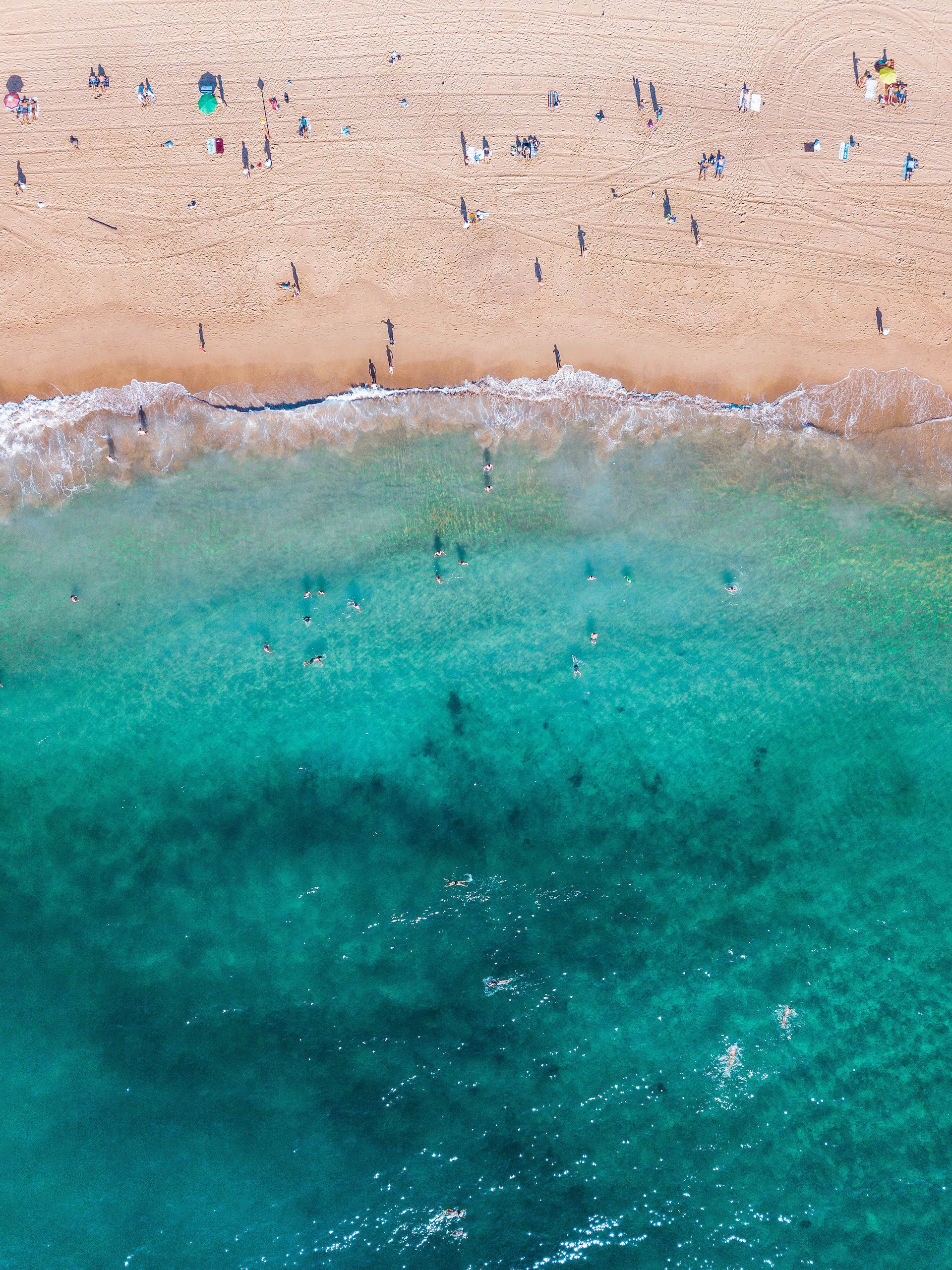 Blue waters blending into the beach