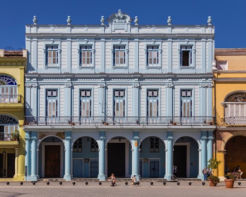 Traditional blue building with striking archways in Havana town centre