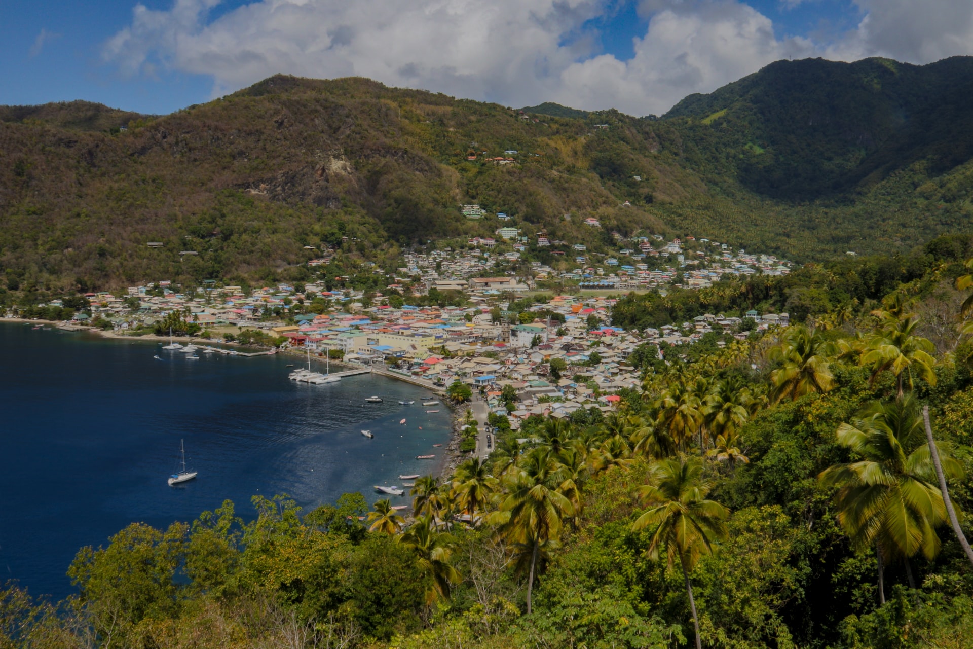 View of a beach town on a tropical island from a hill behind the town