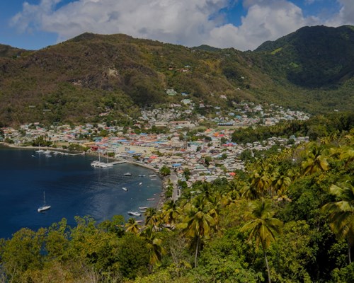 View of a beach town on a tropical island from a hill behind the town