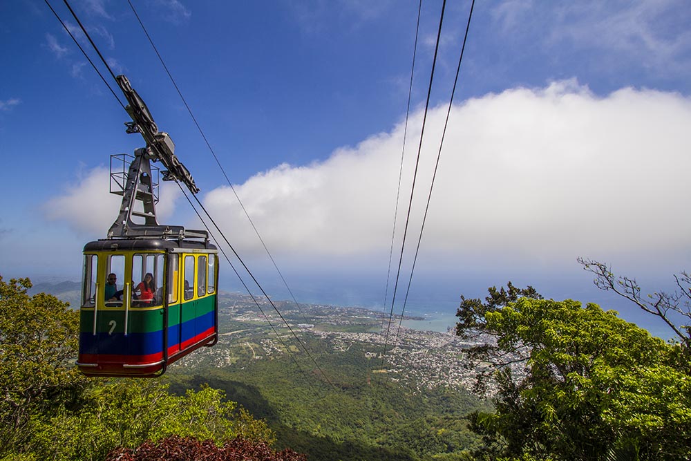 Colourful cable cart moving down Mount Isabel De Torres