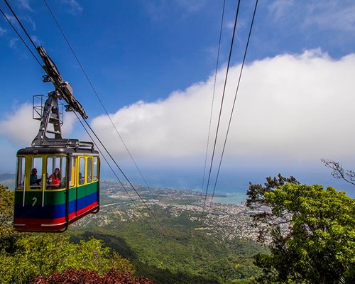 Colourful cable cart moving down Mount Isabel De Torres