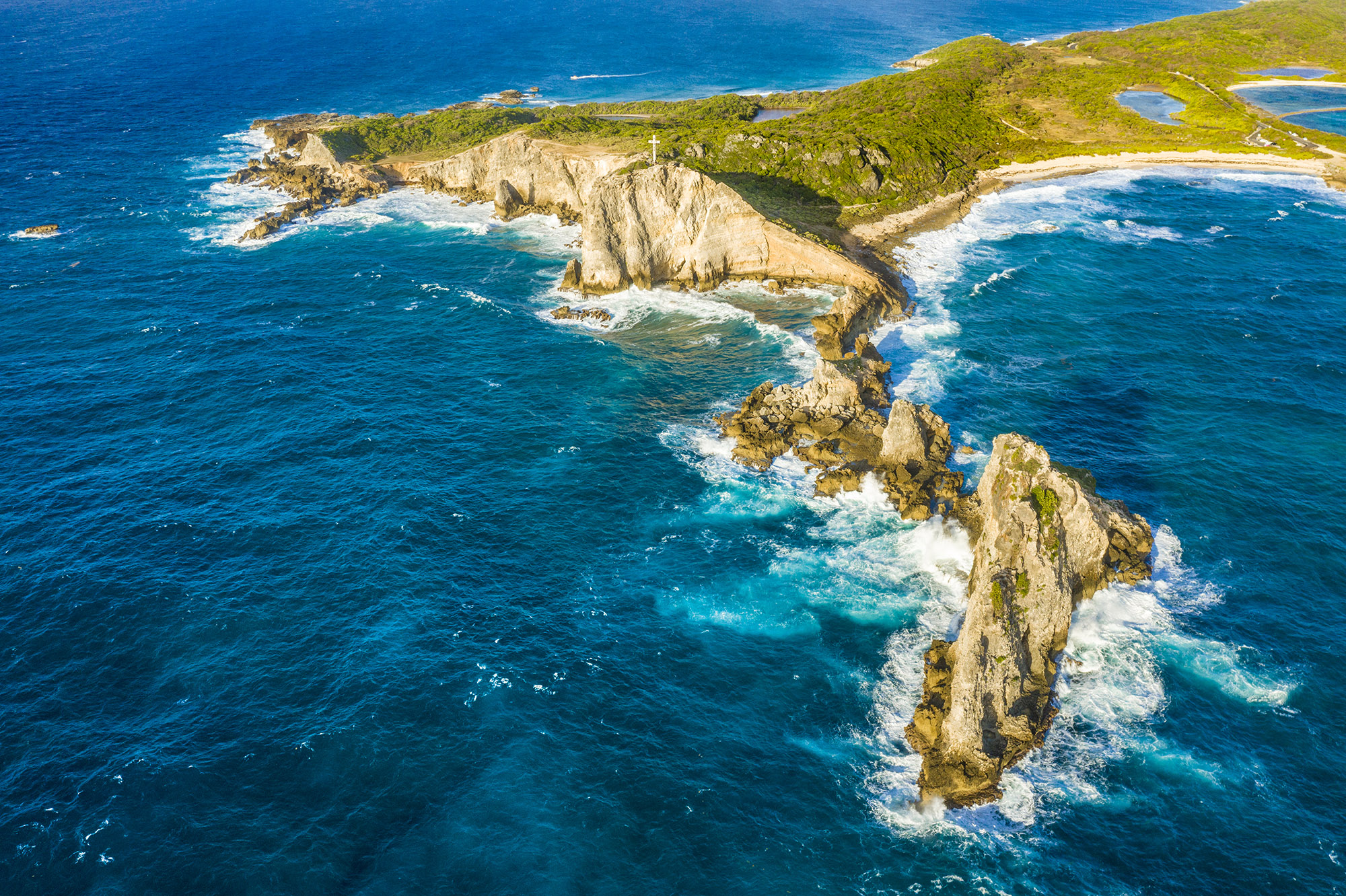 Rugged coastline at Pointe Des Chateaux 