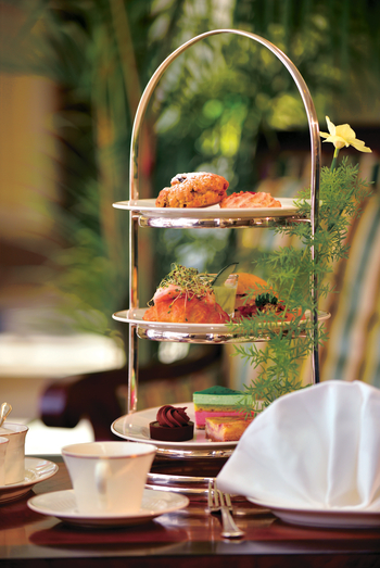 Afternoon sandwiches and cakes with a cup of tea